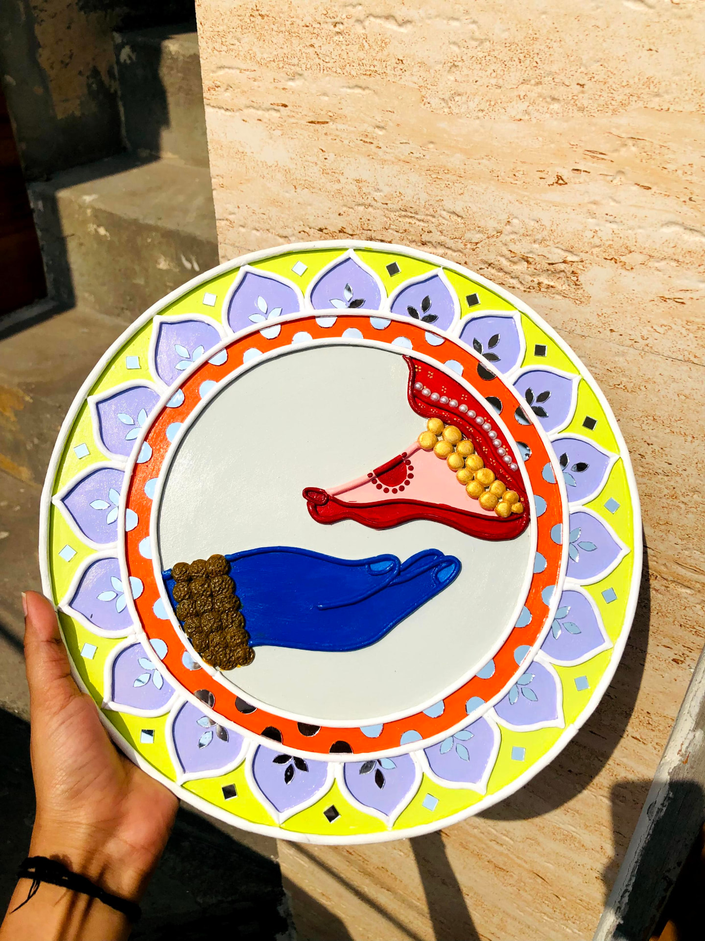 Colorful Lippan diya artwork with raised mirror pattern